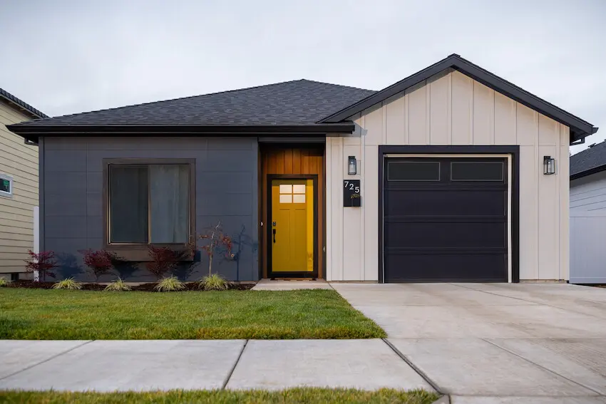 Home clad in Hardie® Plank Lap siding in Weathered Cliffs and a custom green